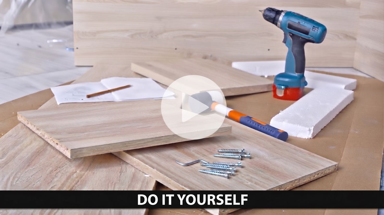 Woodworking project laid out on a workbench with tools and hardware